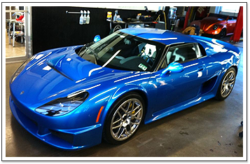 Auto Window Tinting in Denton, TX | FlexShield Window Tint & Car Audio | Blue Car with Tinted Windows